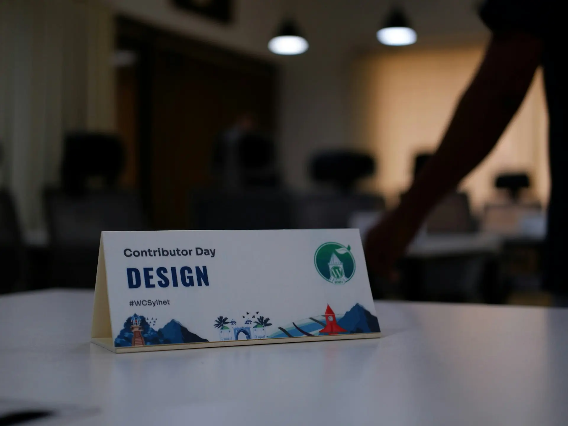 a sign sitting on top of a white table